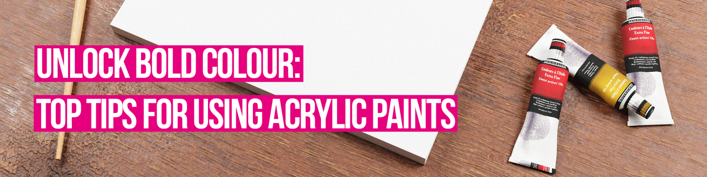 Image of an acrylic pad on a wooden table with paints. There is text over the top which says "Unlock Bold Colour: Top Tips For Using Acrylic Paints"