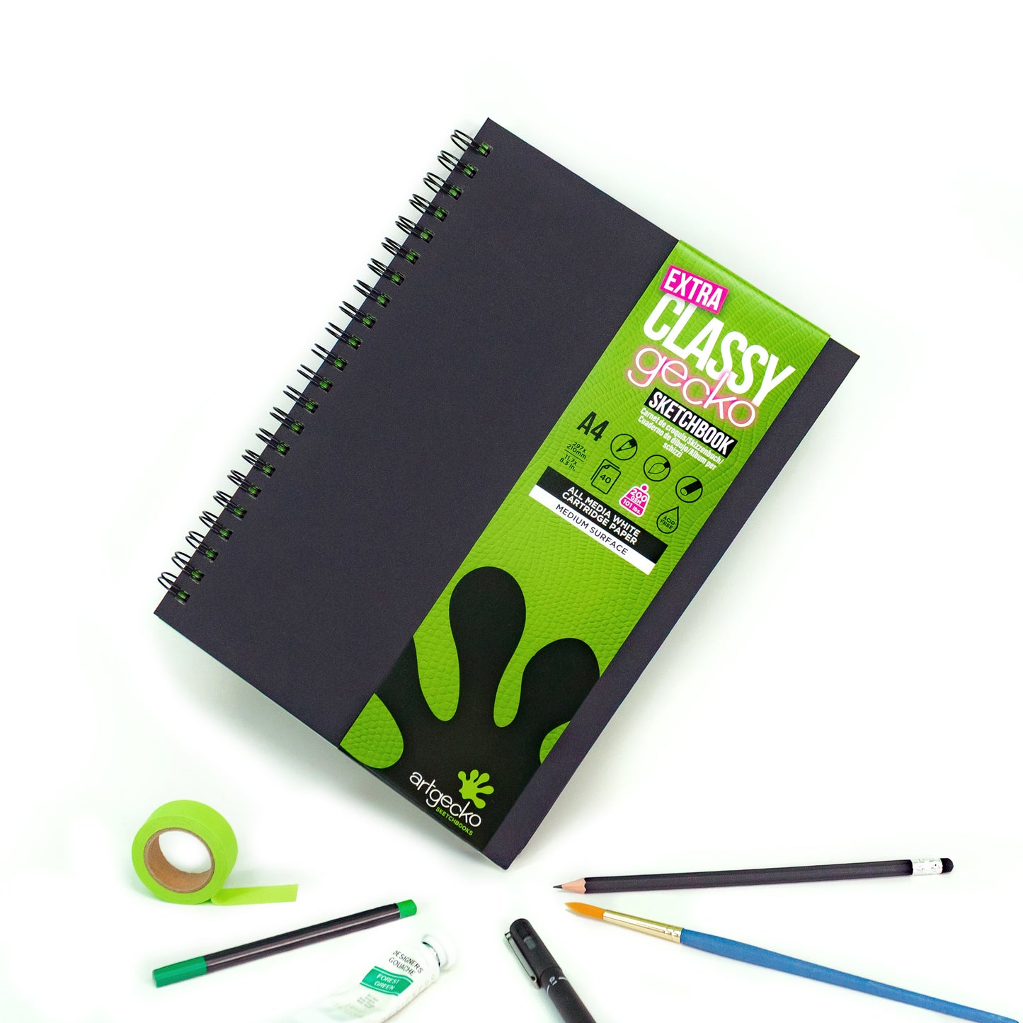 Artgecko Extra Classy A4 Sketchbook on white background surrounded by a variety of media types