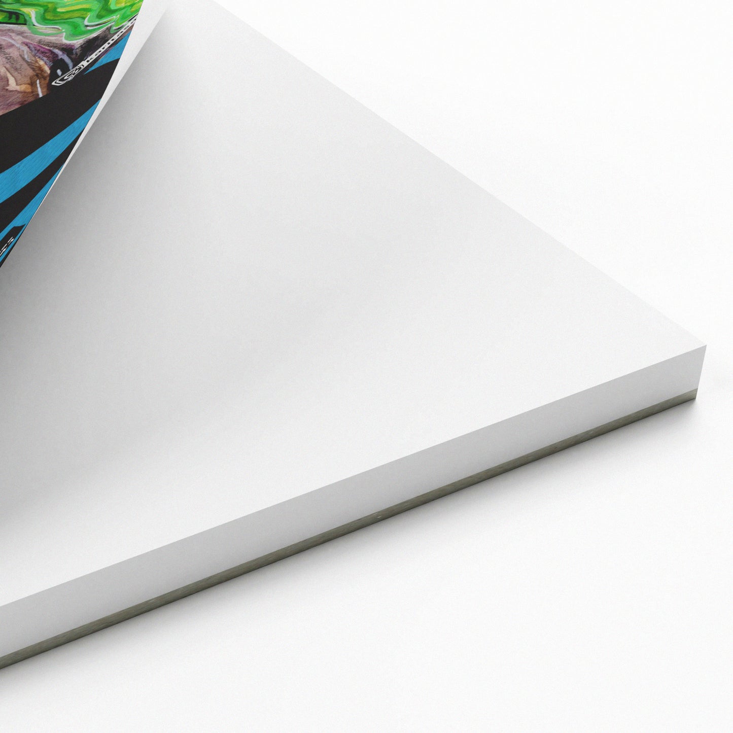 White paper pad with a corner folded over on a white background
