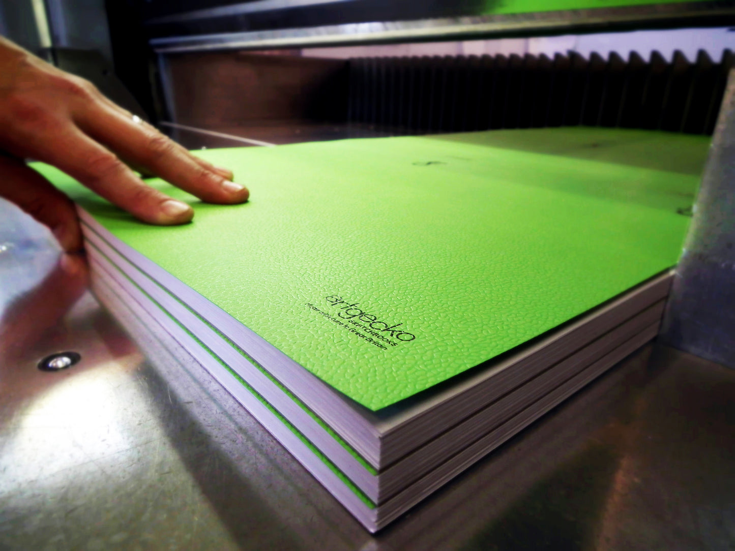An image of Artgecko papers being cut to size during production