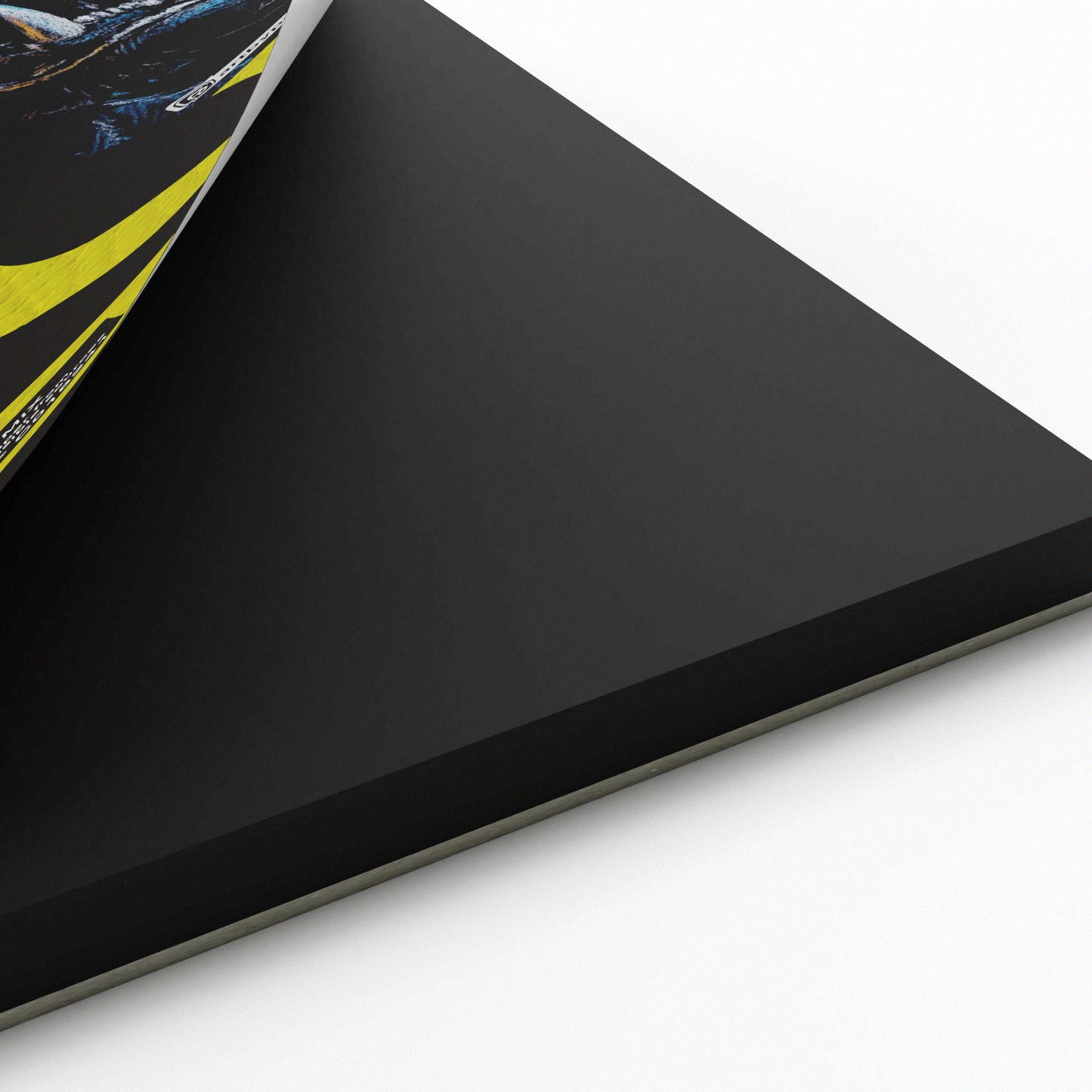Corner of black toned Pro Gecko Sketch Pad showing black card inside pad.