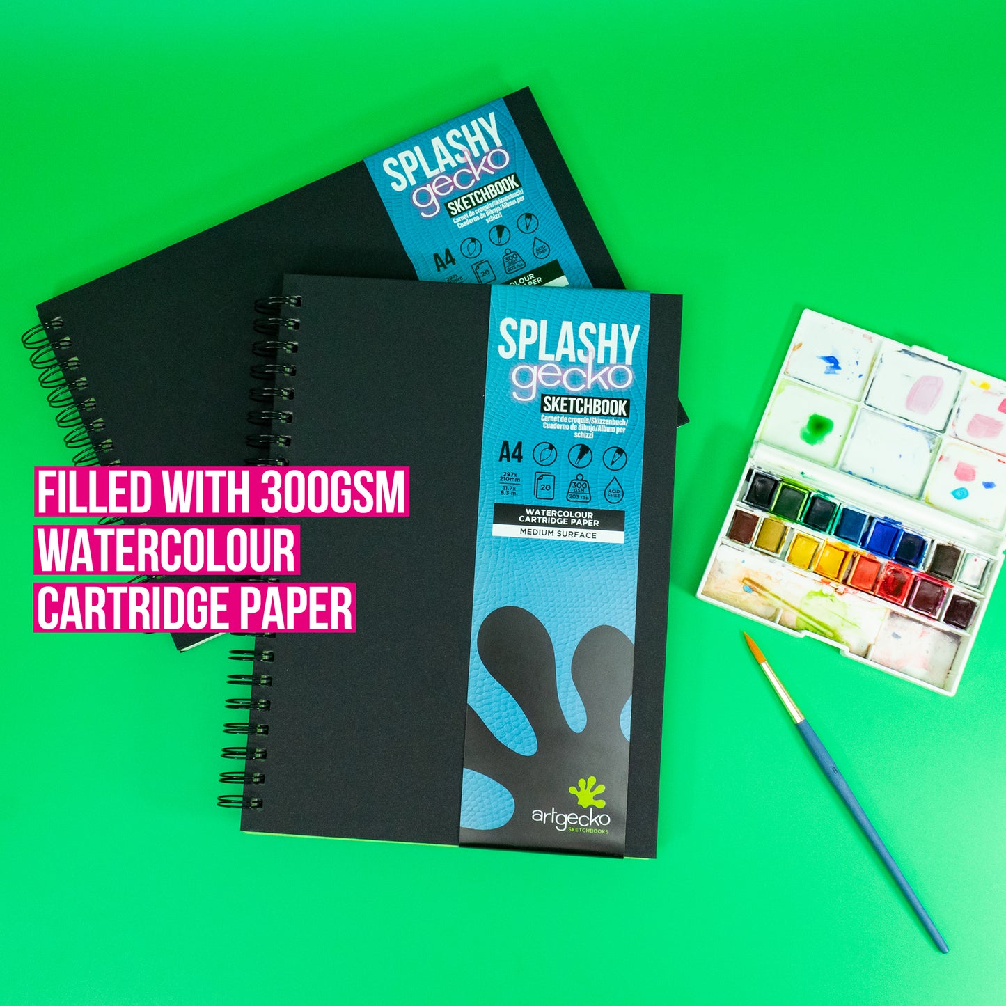 Splashy Gecko Watercolour Sketchbooks by Artgecko. These books contain 300gsm watercolour cartridge paper and are ideal for wet media. Sketchbooks are on display on a green background.