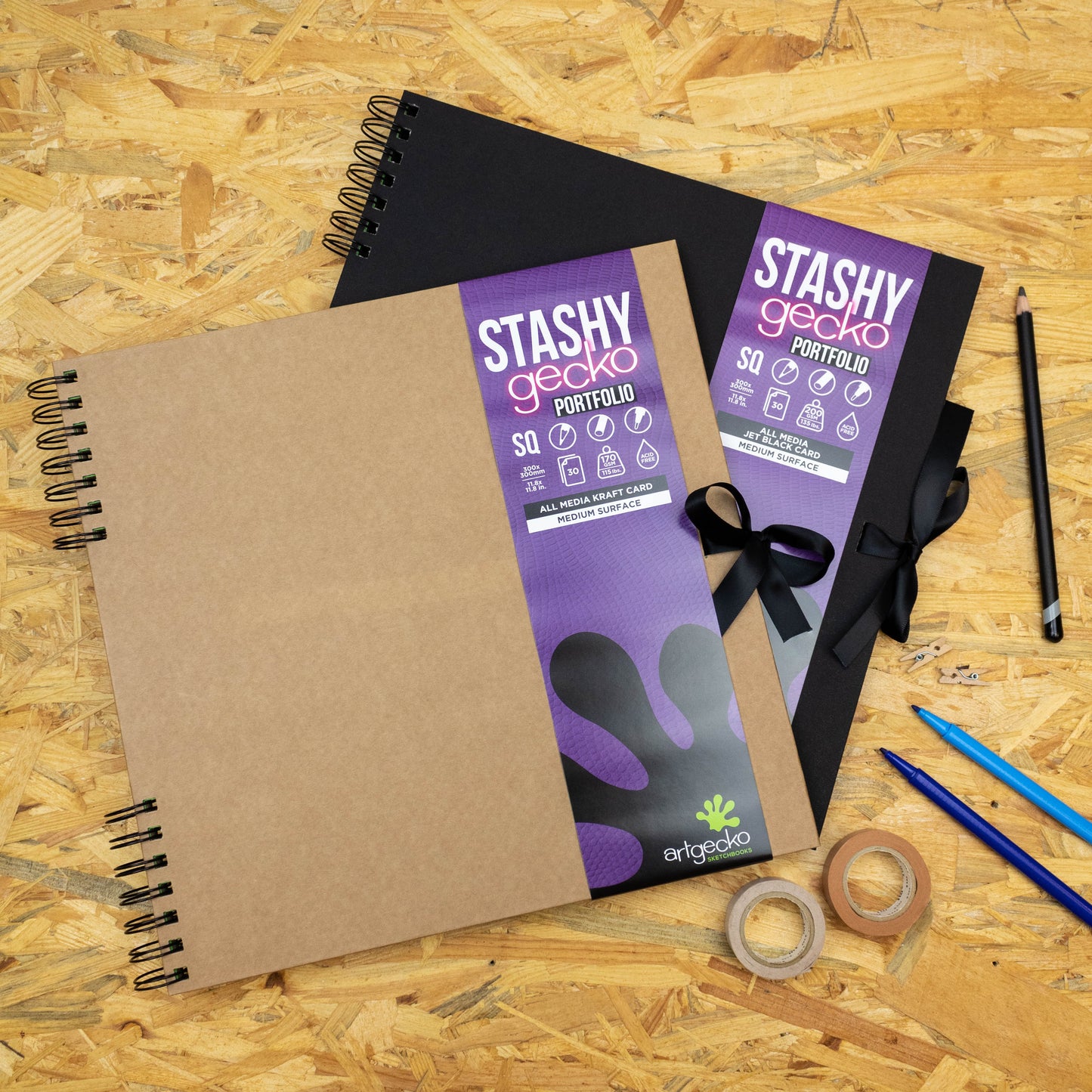 Stashy Gecko Scrapbooks on wooden desk