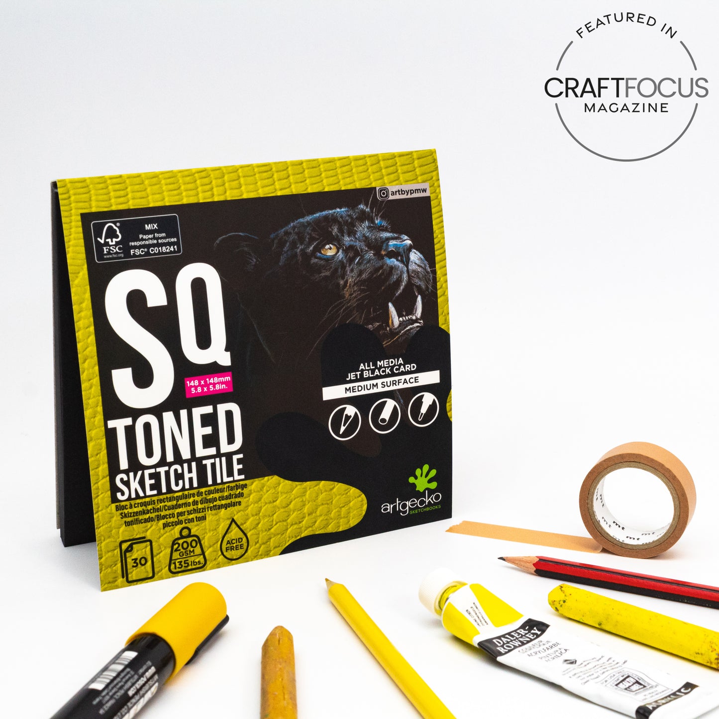 Lifestyle image of a Pro Gecko Toned Black Sketch Tile surrounded by media suitable for this pad.
